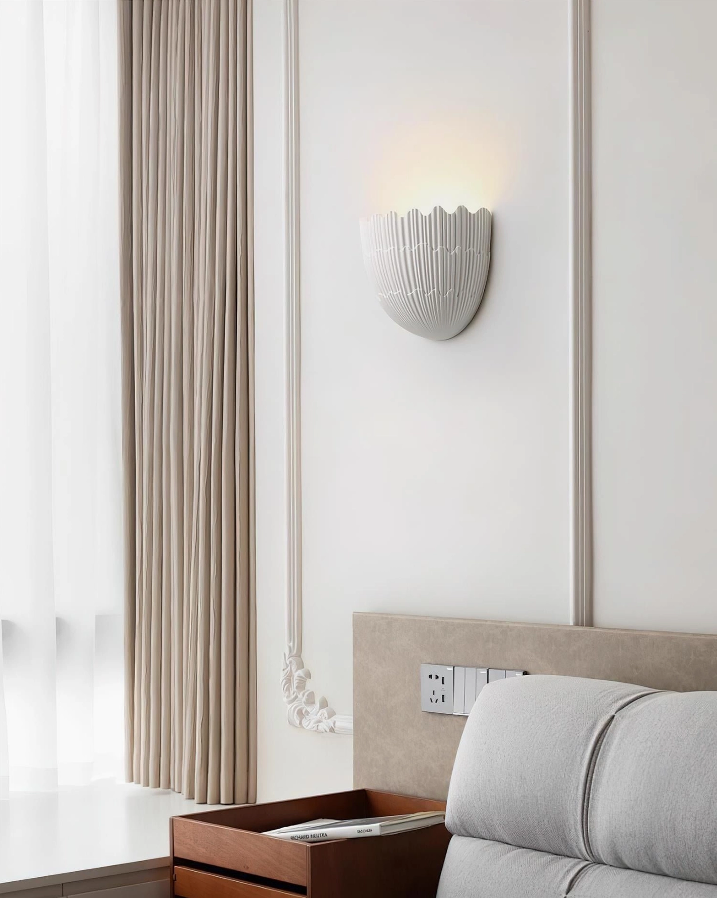 Shellora ceramic wall sconce warm glow illumination architectural detail