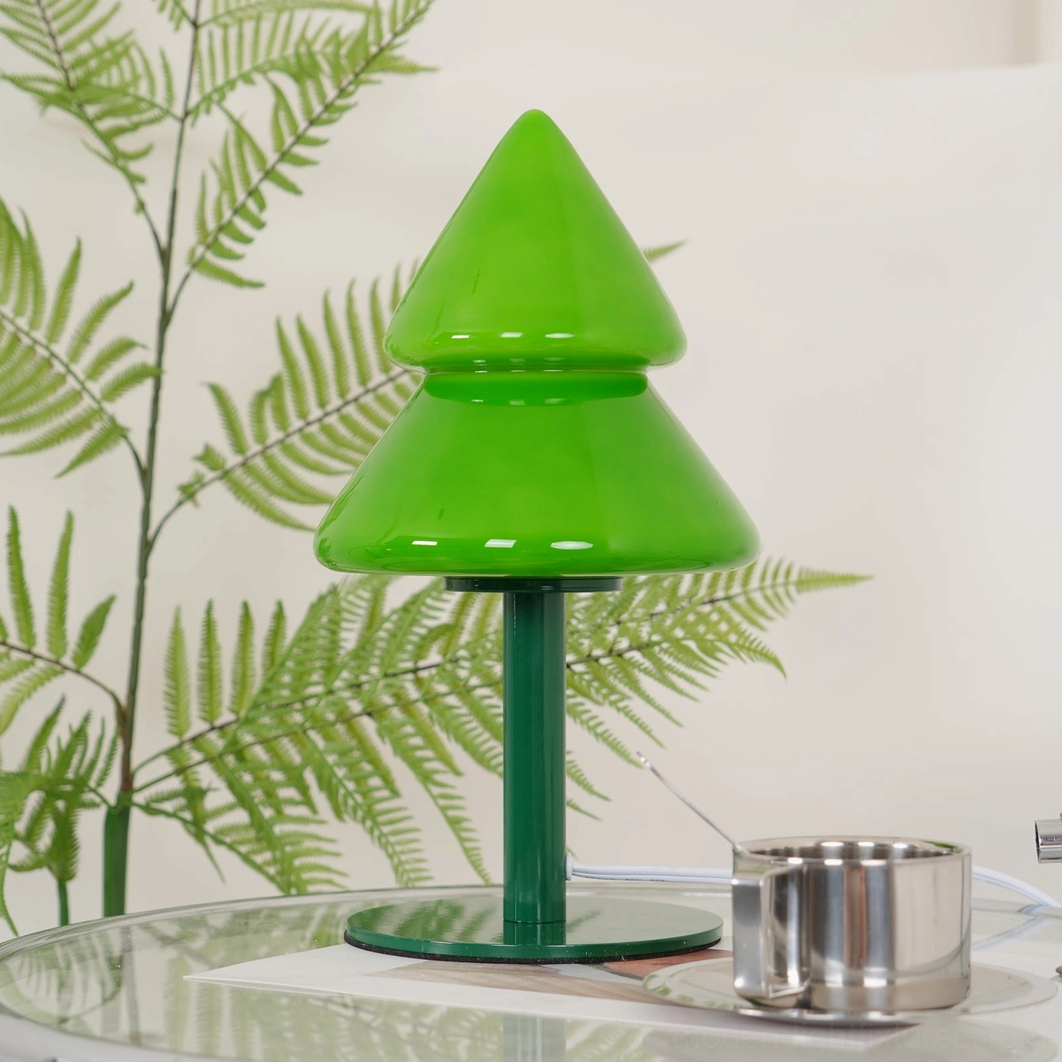 Side profile view of modern Christmas tree lamp showing sculptural silhouette design