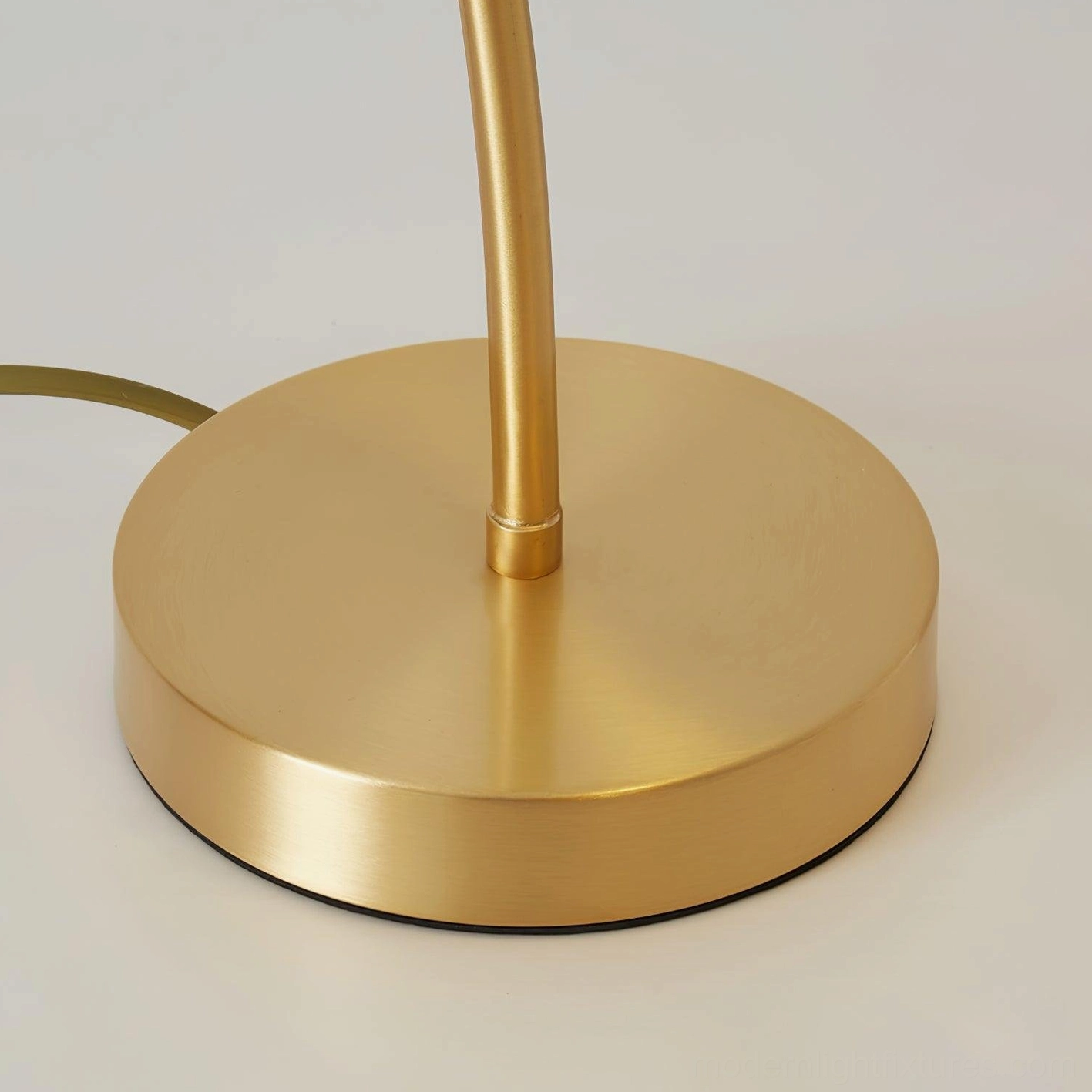 Brass table lamp lifestyle shot showing elegant placement in contemporary interior, design and functionality