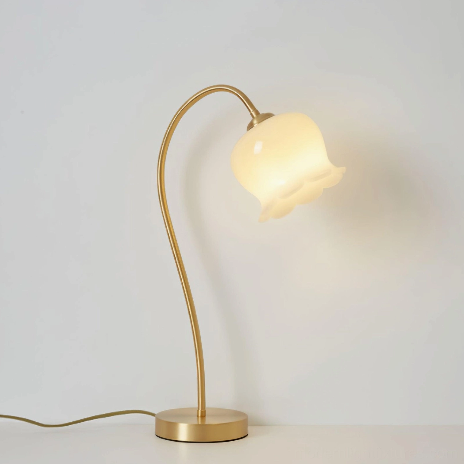 Siena brass table lamp with lily flower silhouette, contemporary minimalist design, brass and white finish