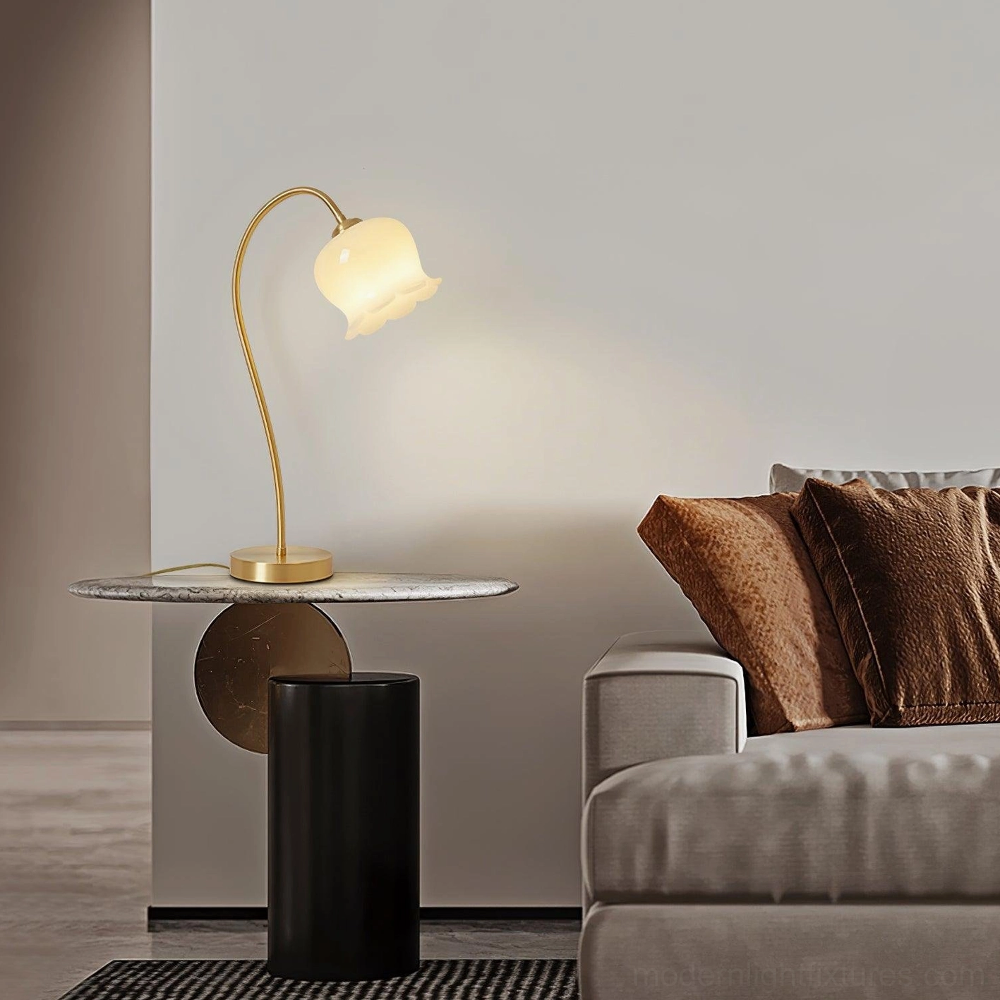 Modern brass table lamp in contemporary living room, positioned on marble side table next to sofa set, warm ambient lighting