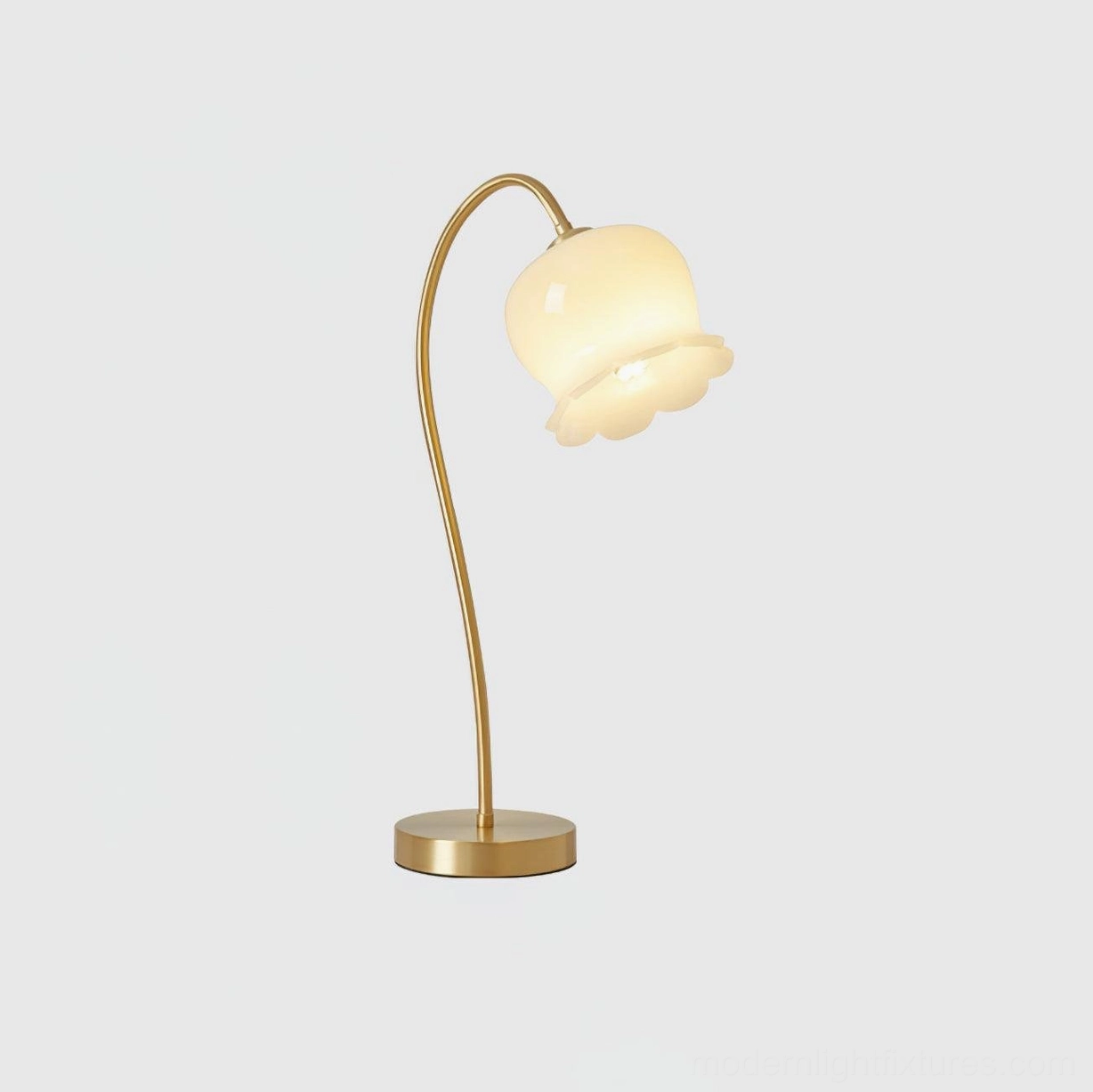 Front three-quarter view of luxury modern brass table lamp, sleek minimalist design with brass gold finish