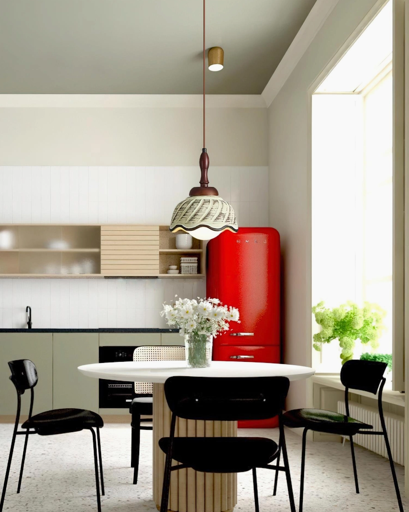 Sienna pendant light installed over round dining table in vintage kitchen with red refrigerator