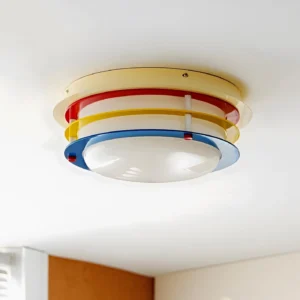 Multicolor layered ceiling light fixture mounted overhead showing metal fasteners and glossy painted finish detail