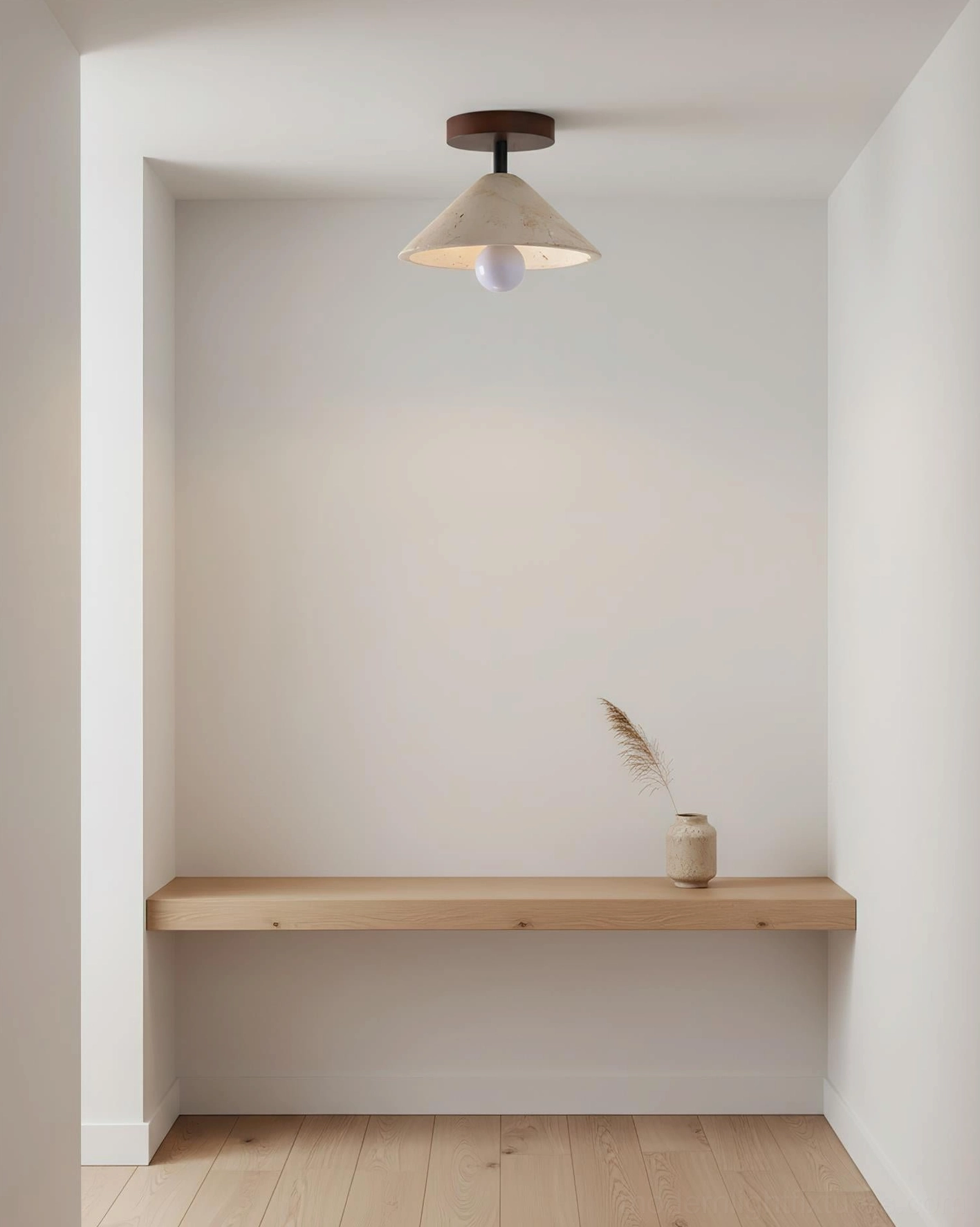 Sierra travertine ceiling light installed in minimalist alcove with floating wooden shelf