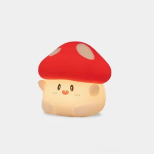 Red and white soft silicone mushroom night light with warm glowing LED, front studio view with cute facial design