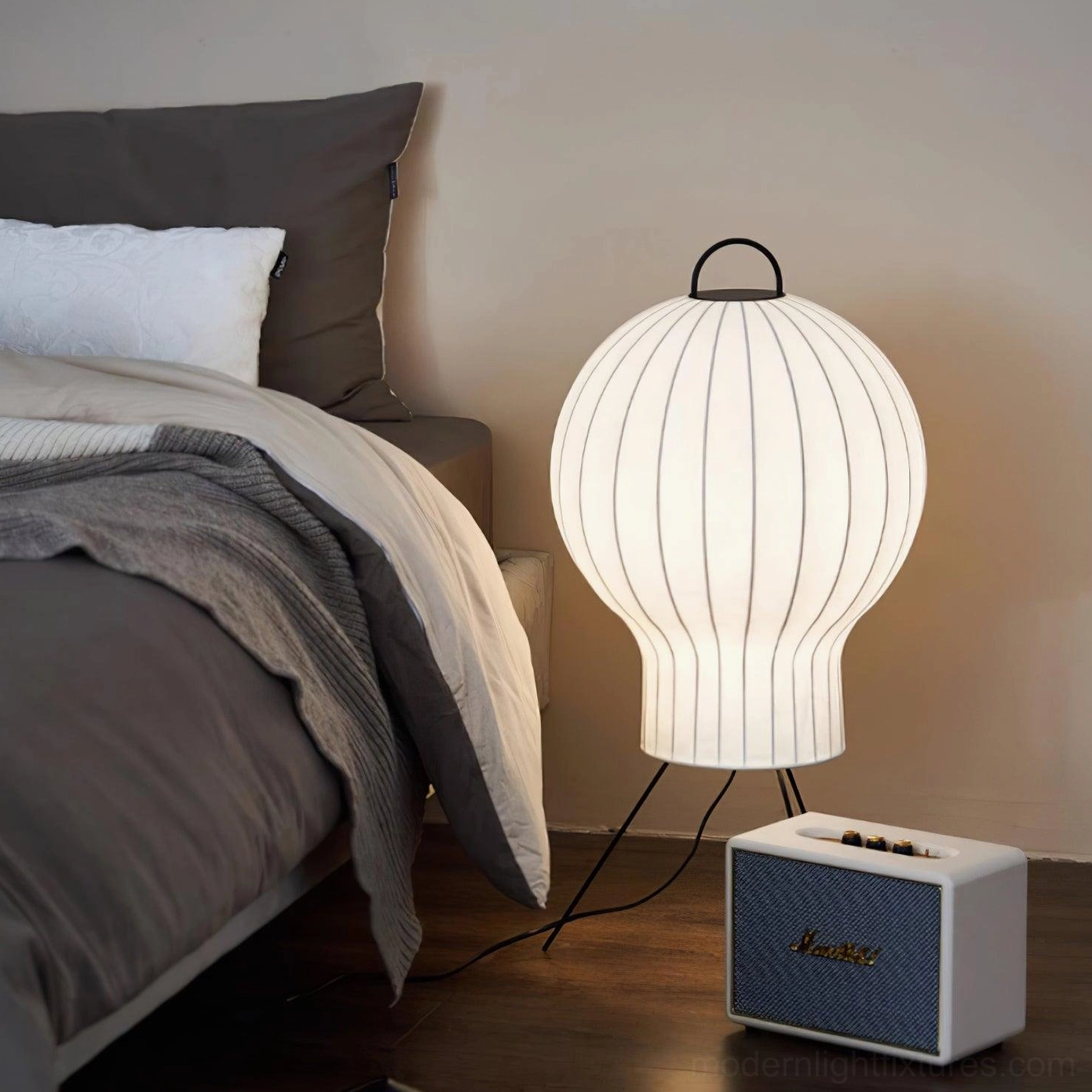 Handcrafted silk floor lamp in modern bedroom interior with warm ambient lighting