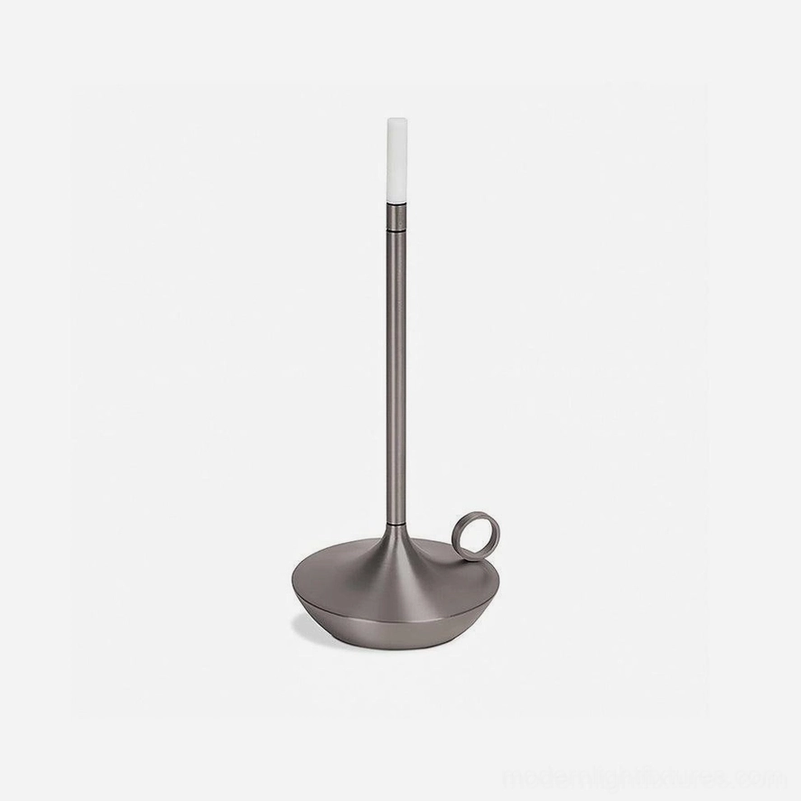 Silver LED candle table lamp demonstrating neutral metal finish complementing warm and cool interior palettes