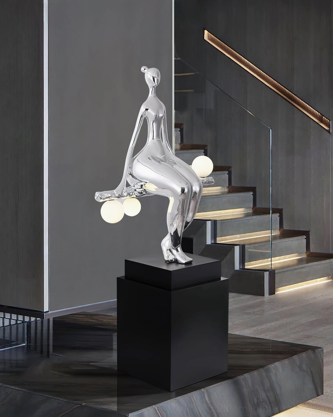 Glossy silver polished human sculpture floor lamp with three globe lights, modern staircase contemporary interior