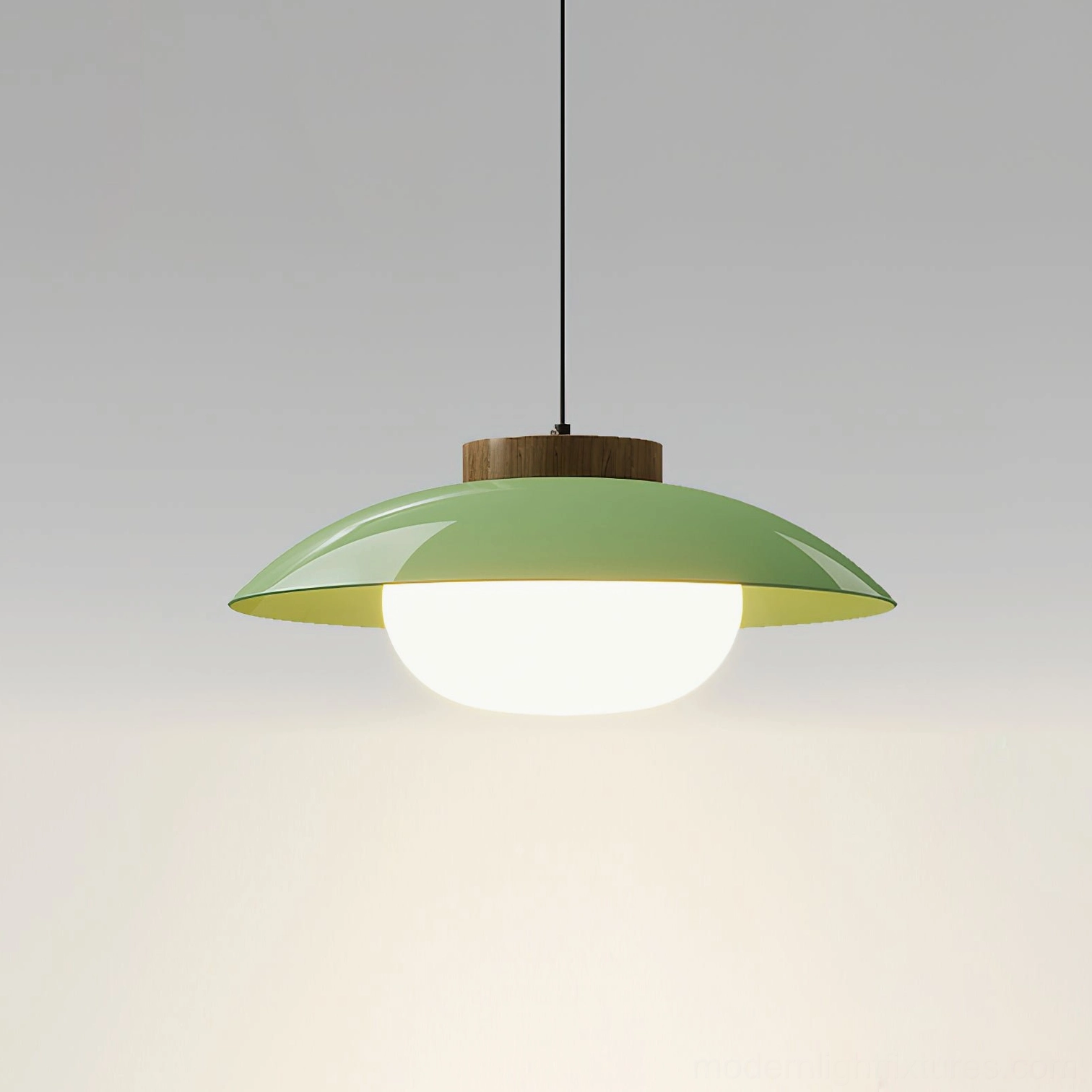 Contemporary plug-in saucer pendant fixture with sage green diffuser and wooden crown detail, ceiling-suspended eye-level perspective