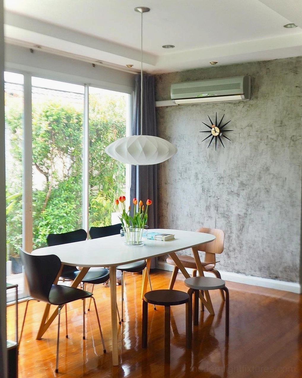Single bubble pendant light above dining table - modern home lighting