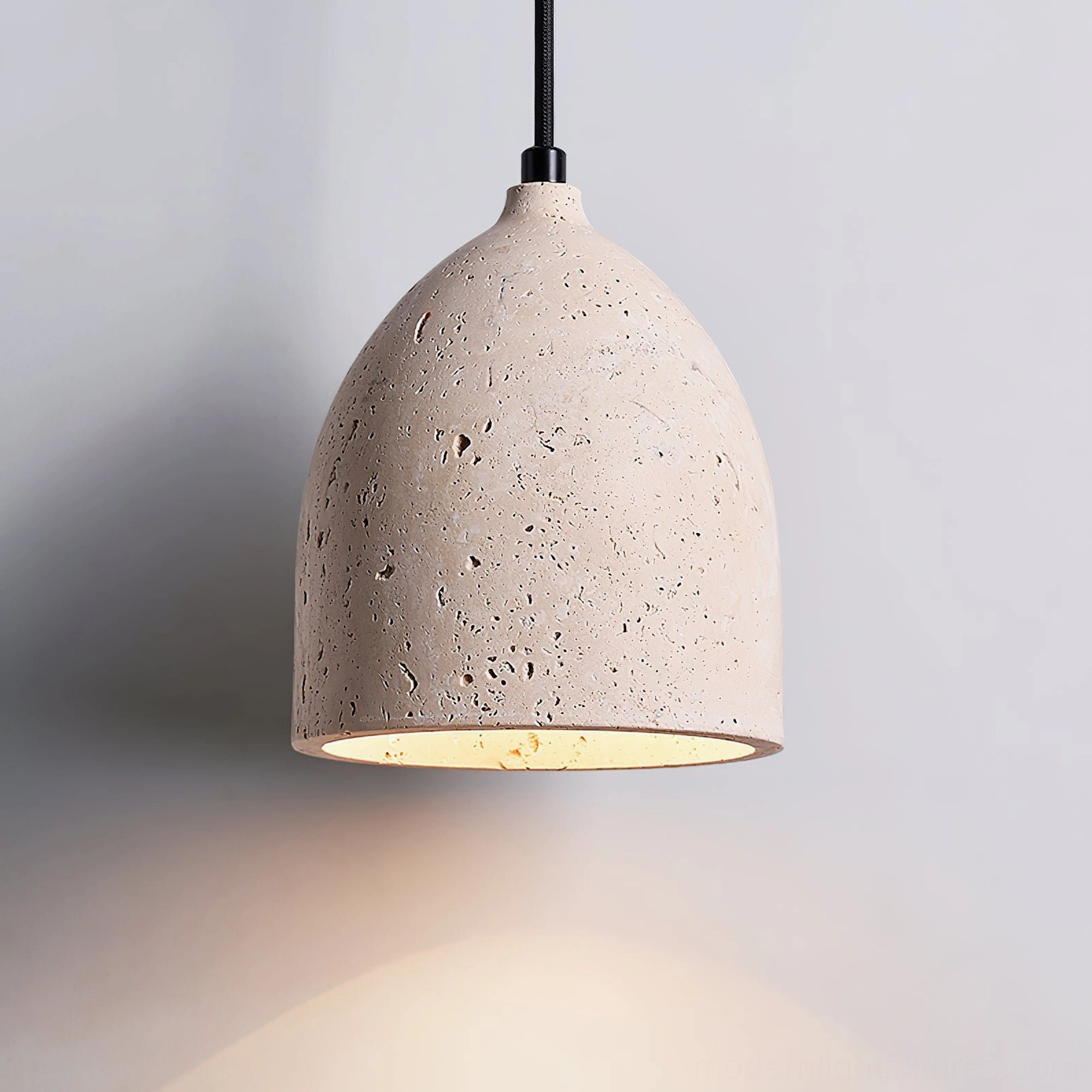 Compact 15cm diameter single volcanic travertine pendant light with E26 socket and warm illumination