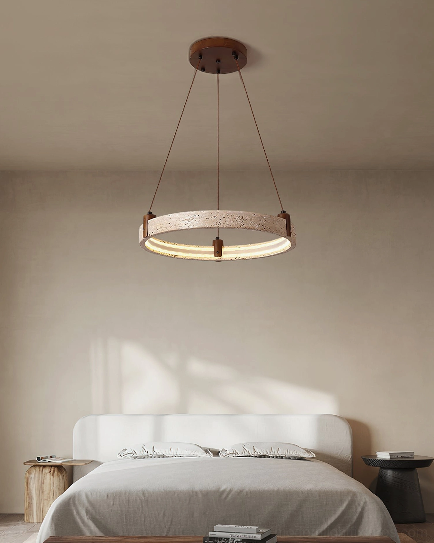 Single travertine ring pendant light in minimalist bedroom with warm ambient glow