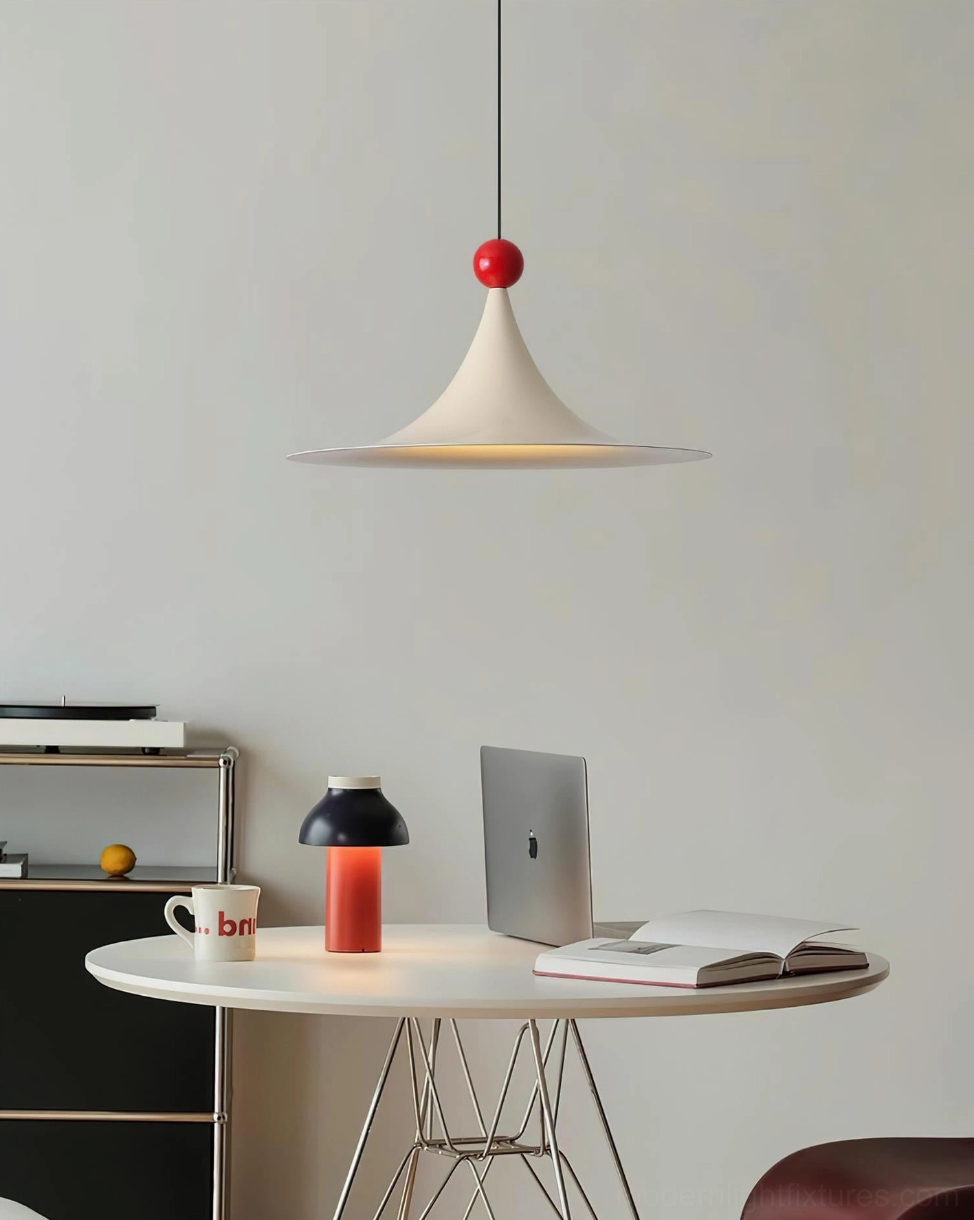 Sirocco cream sculptural pendant light with red sphere accent in contemporary home office, side view