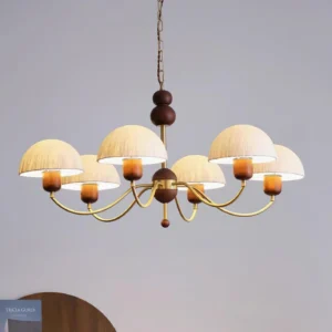 6-head modern chandelier with brass frame and walnut wood fixture, illuminated fabric shades overhead view