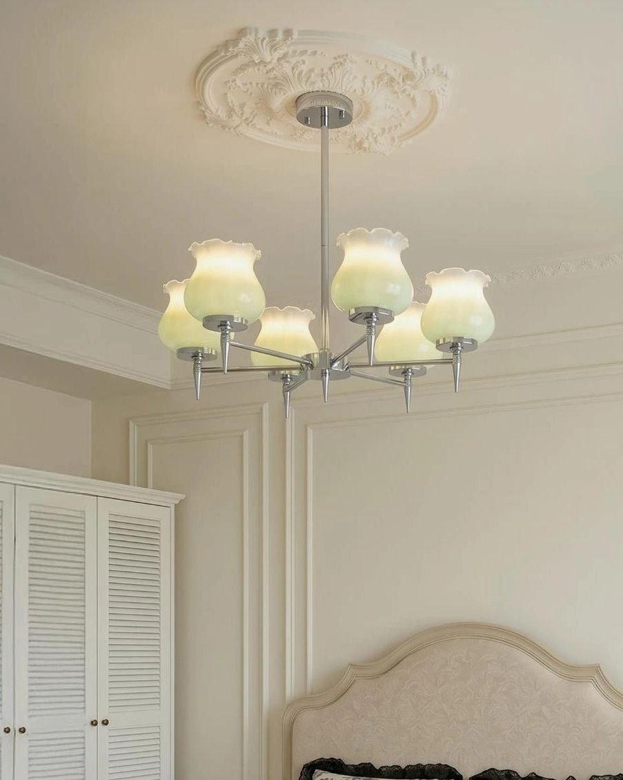 Skylin chandelier central hub connection showing polished chrome radial arm structure and adjustment hardware