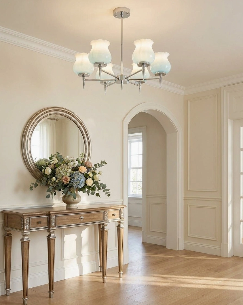 Skylin chrome chandelier with white frosted tulip glass shades creating soft ambient light in elegant vintage entryway hall