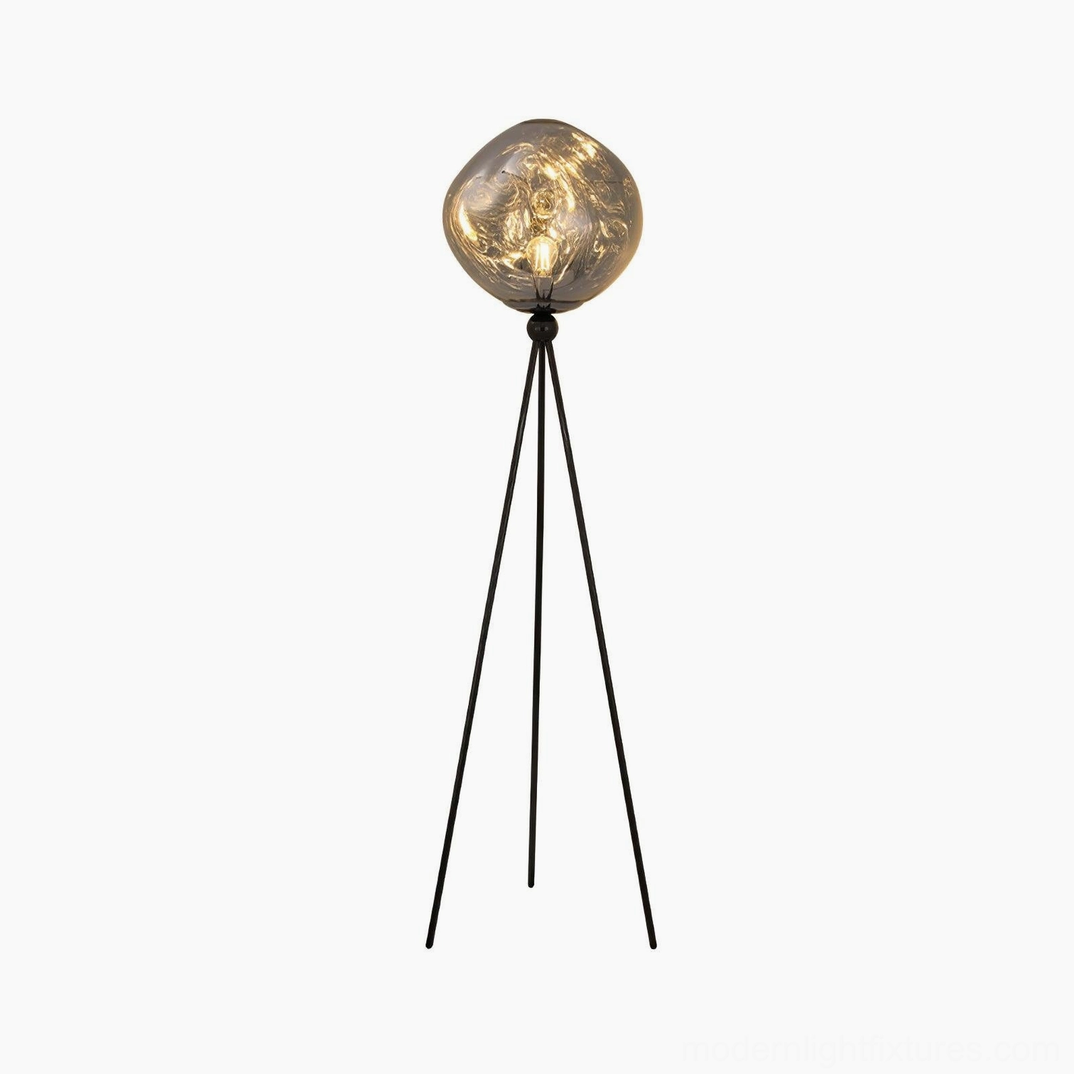 Modern tripod floor lamp with slim black stand and molten spherical glass shade in studio white background