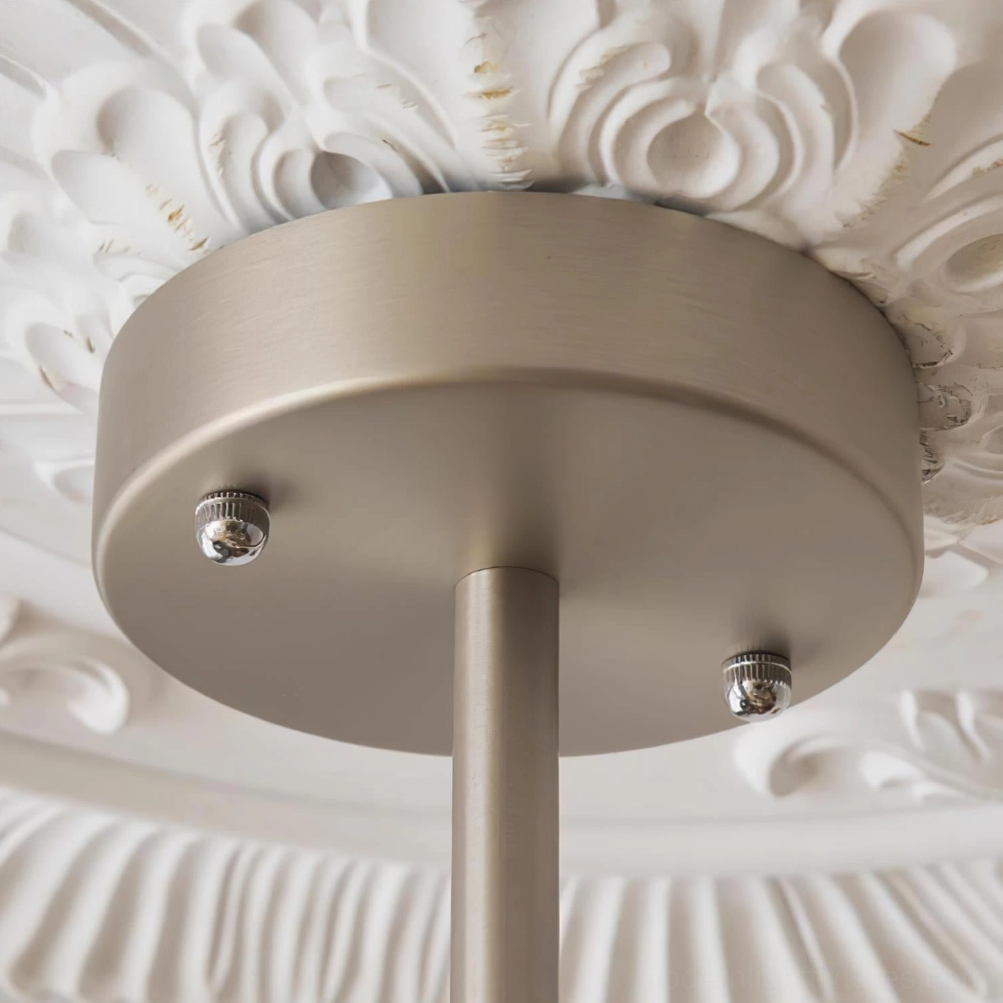 Sloane arc chandelier installed in contemporary home interior design setting