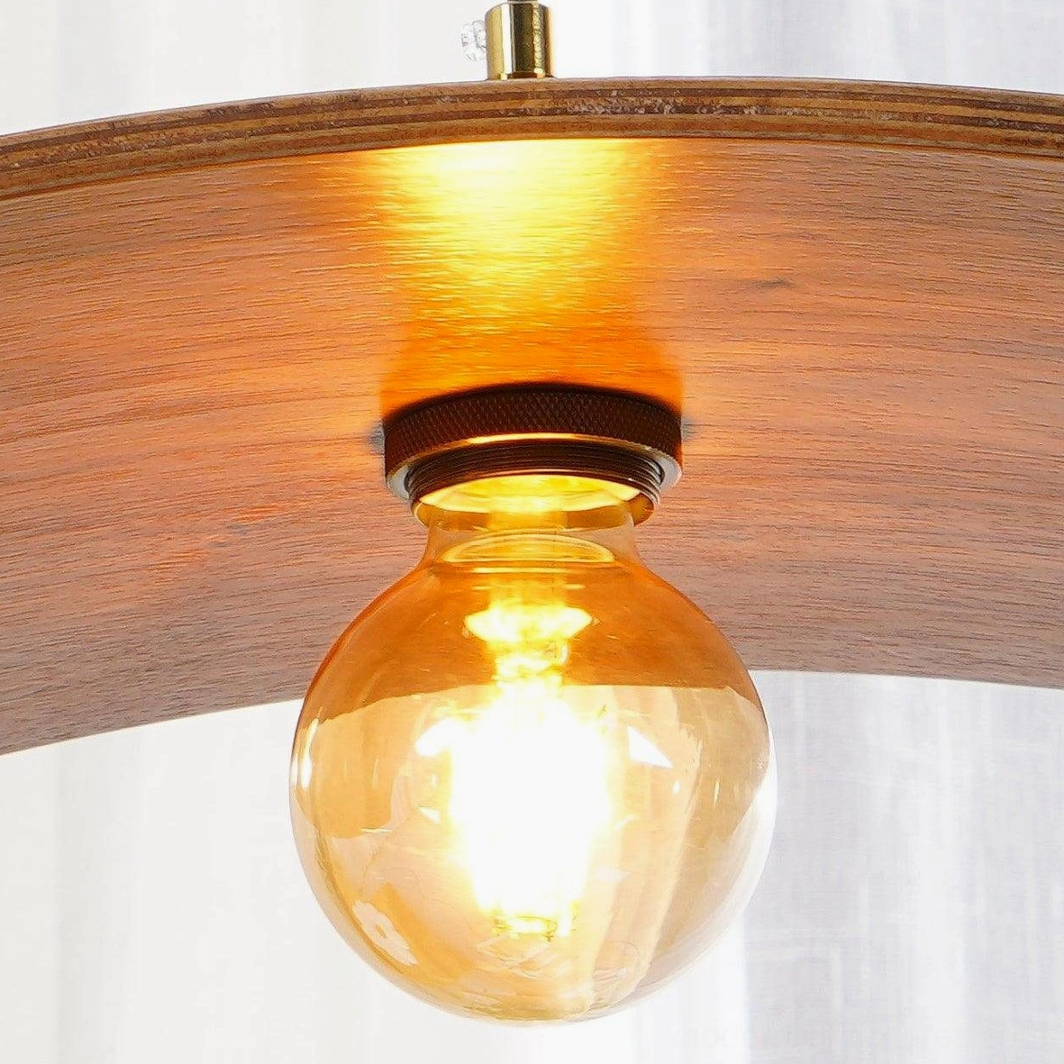 Small walnut leaf pendant lamp in bedroom or intimate space setting with soft ambient lighting