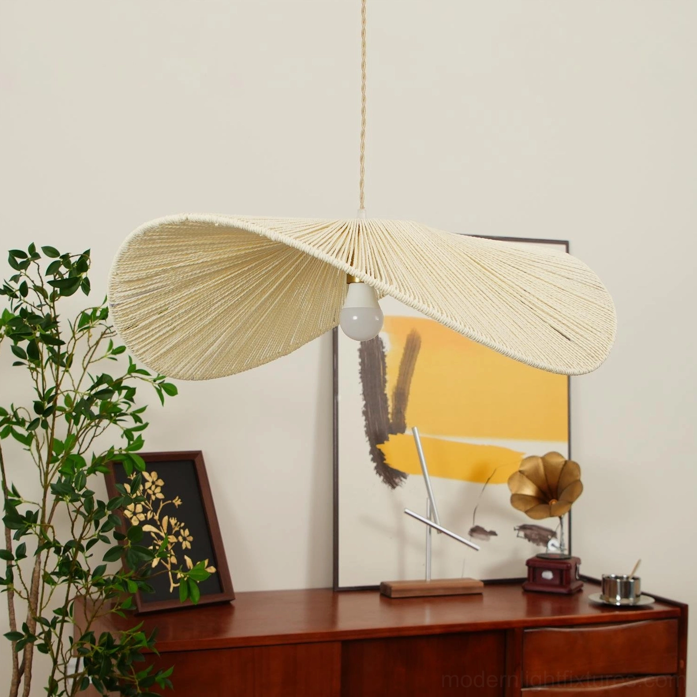 Soft beige handwoven hemp rope straw hat pendant light in serene residential interior setting