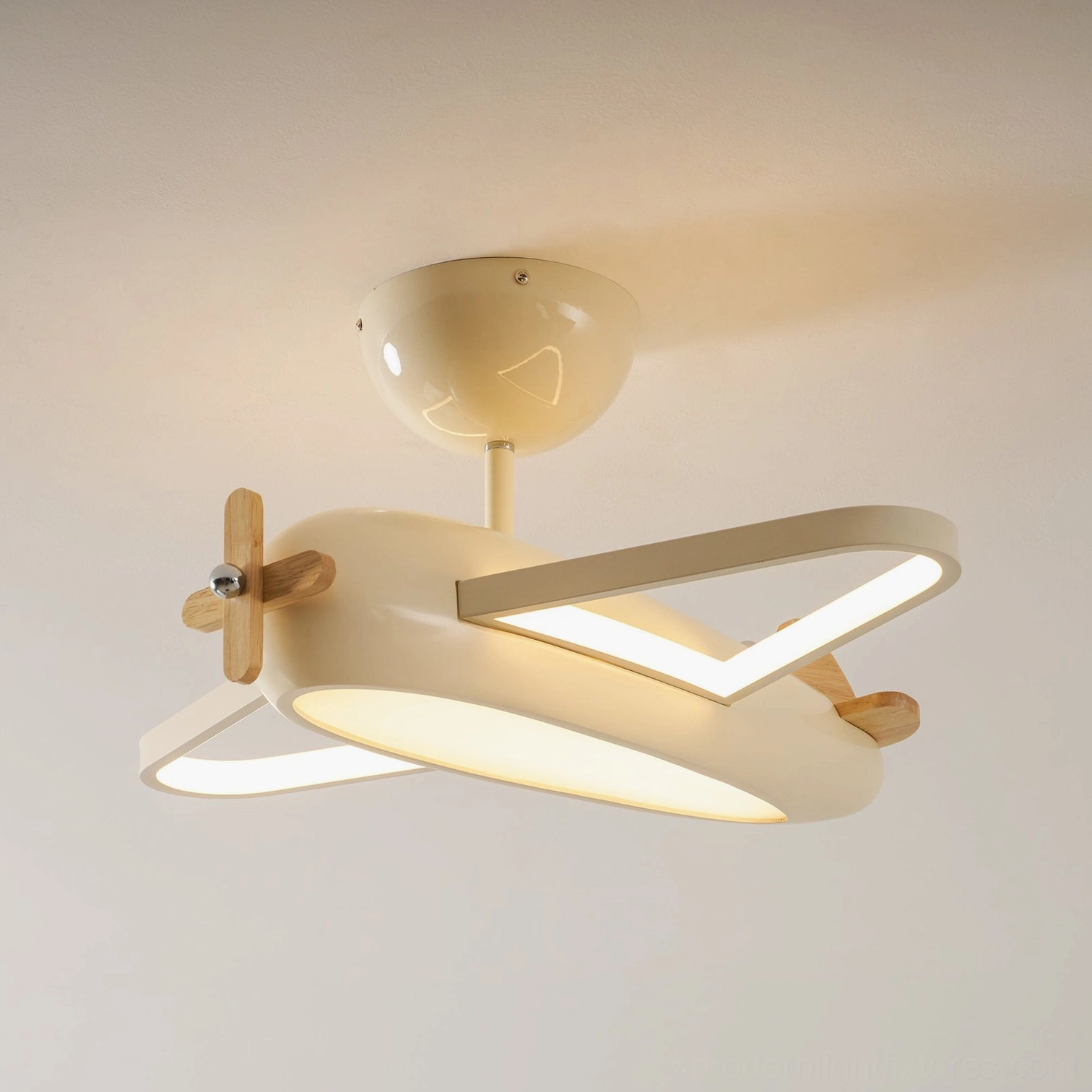 Airplane themed ceiling light in soft blue creating playful yet sophisticated bedroom ambiance