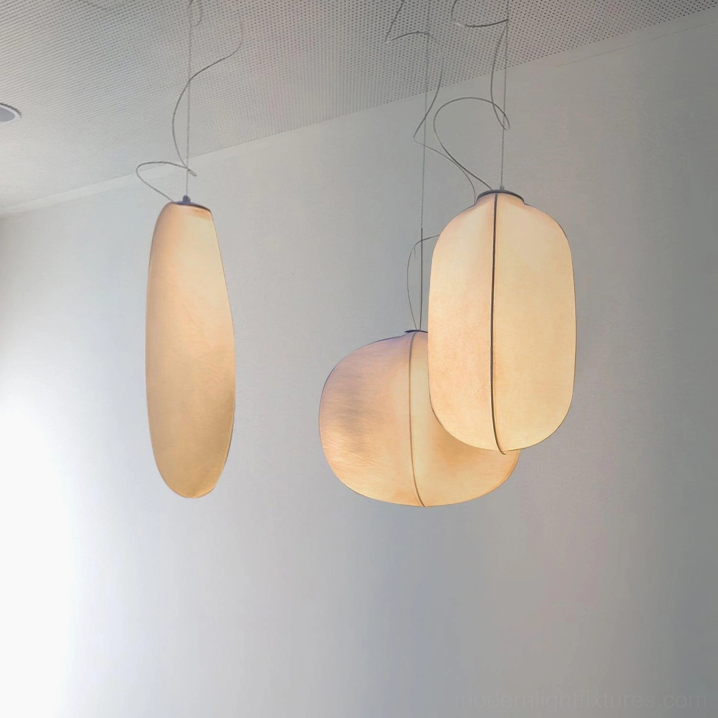 Solaria oblong fabric pendant light low angle side view minimalist white wall