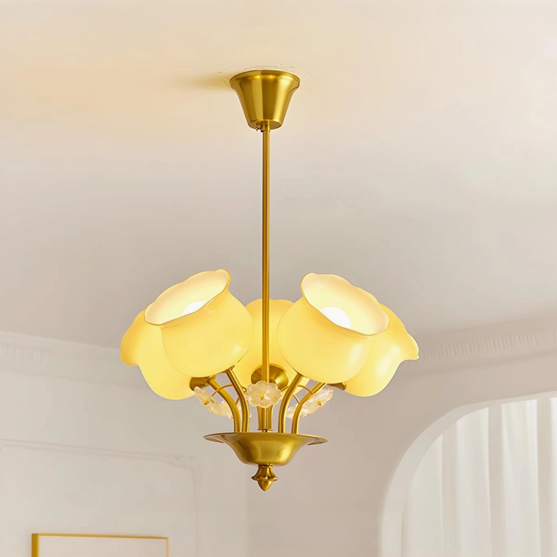 Solenne Petal Chandelier overhead installed view showing five frosted beige glass petal shades and brass structure