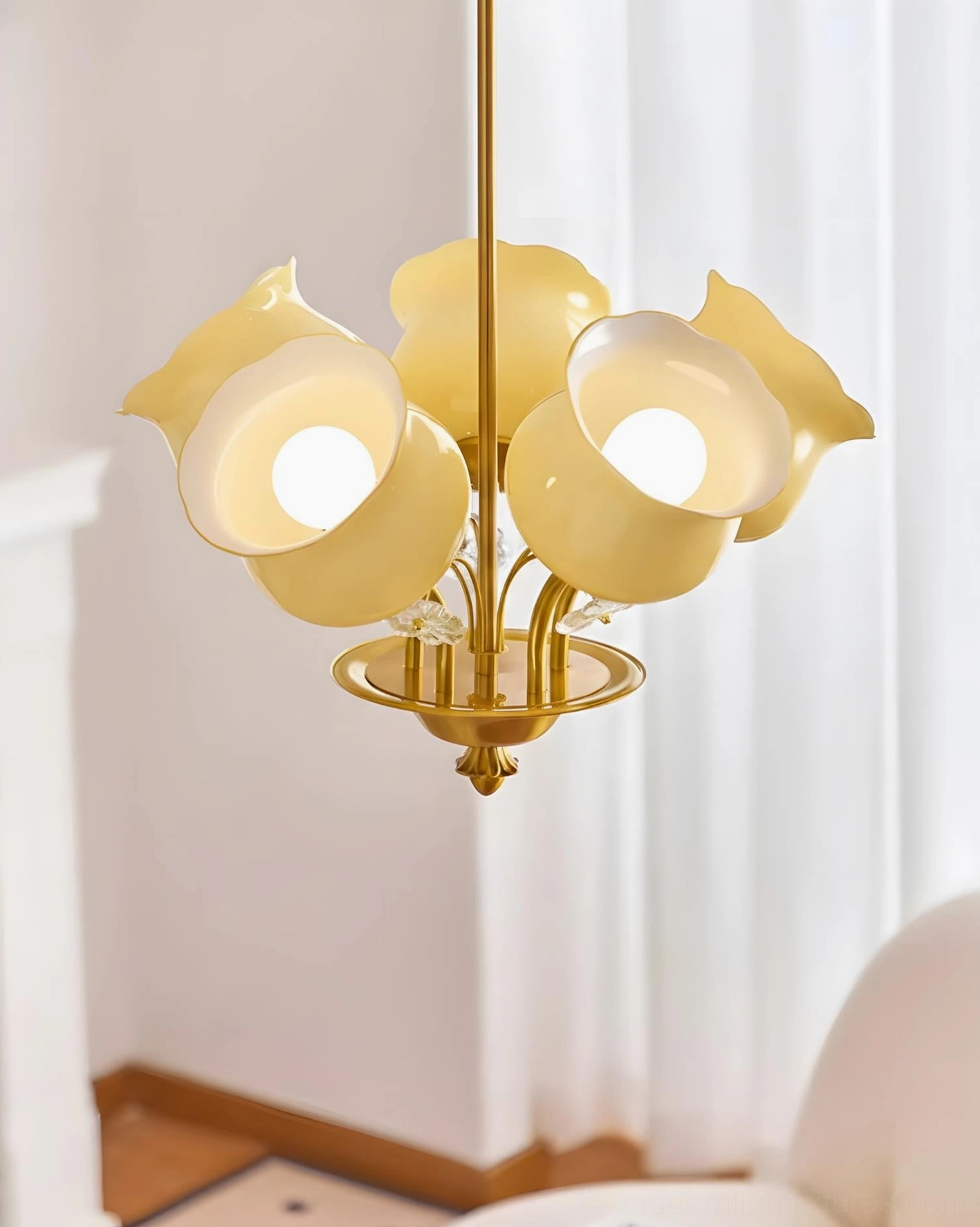 Solenne Petal Chandelier three-quarter angle view in luxury living room with sheer curtains and refined decor