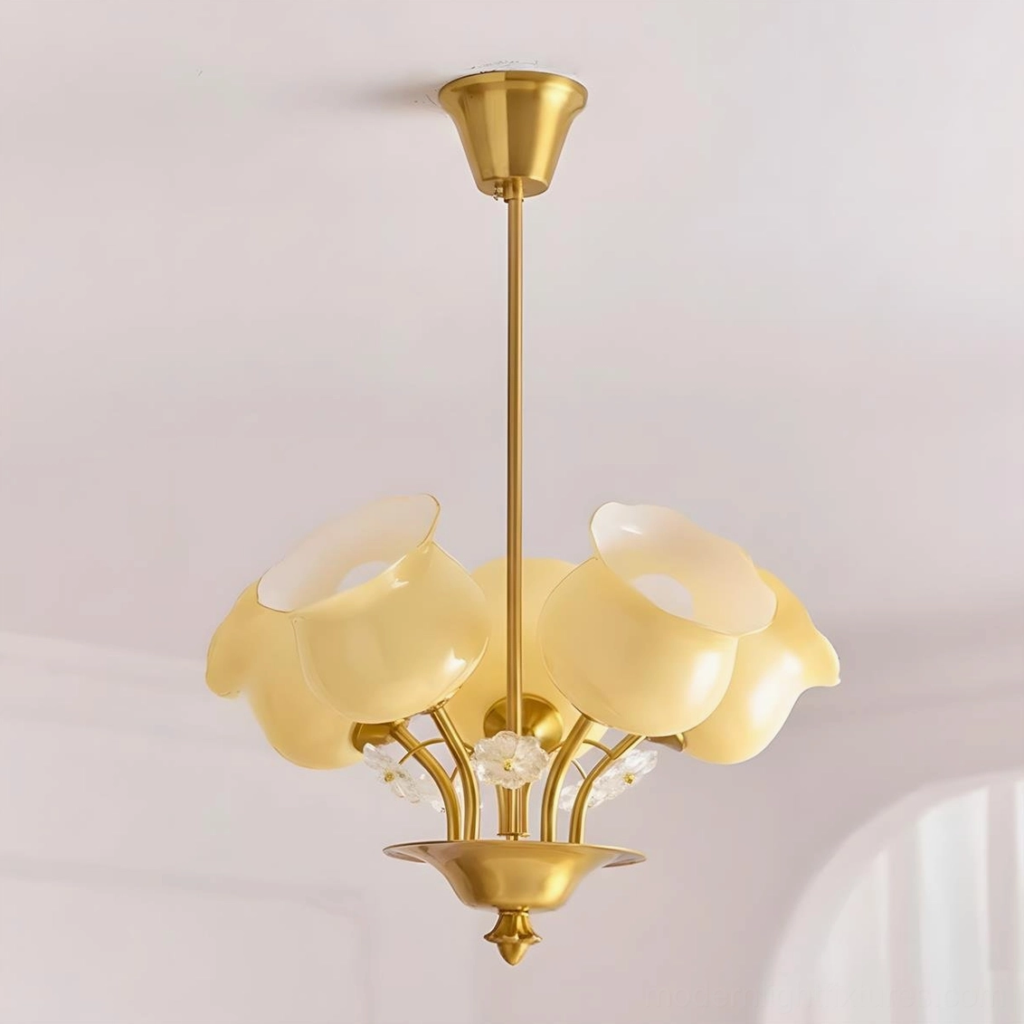 Solenne Petal Chandelier close-up overhead view showing detailed frosted glass flower shades and warm brass metal frame