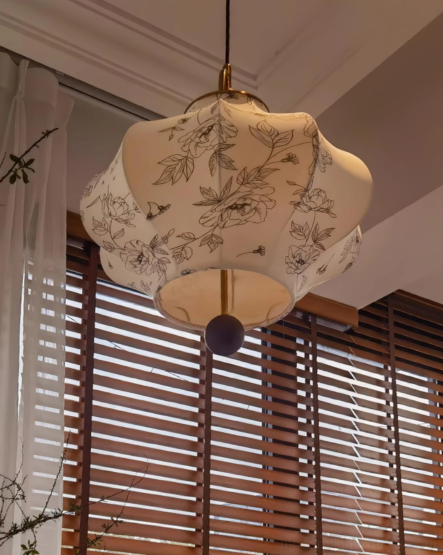 Side view of Soli fabric pendant showing lantern shape and wooden bead detail