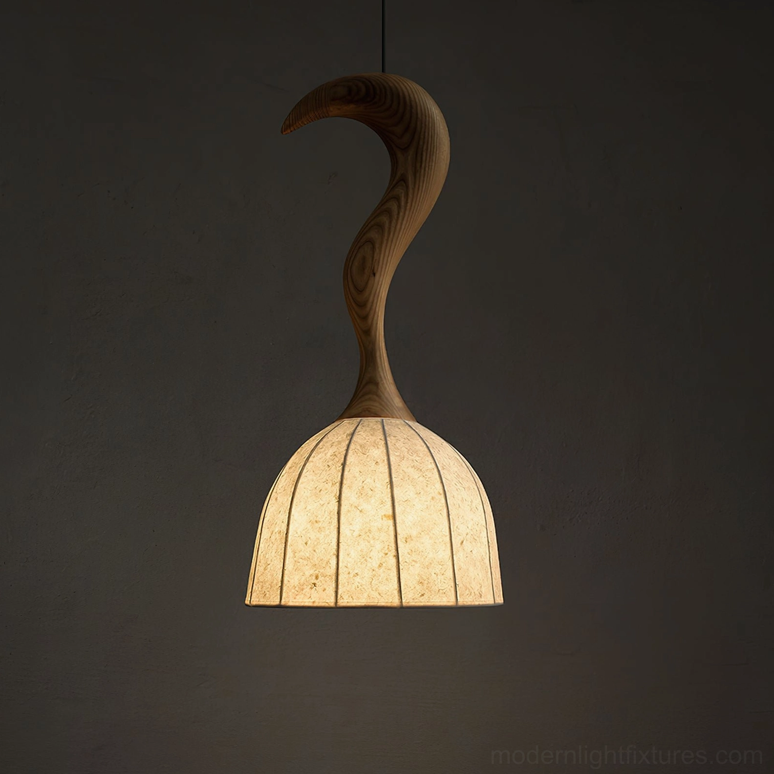 Close-up detail of Solia wooden pendant light showing warm glowing interior light and wood grain texture