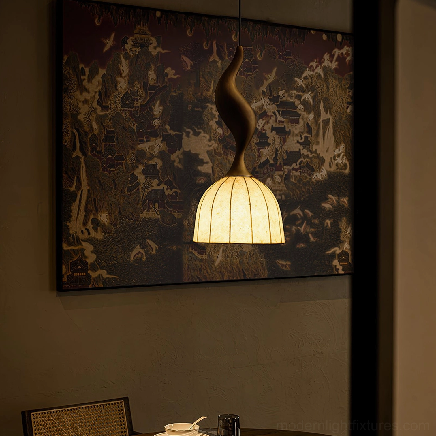 Solia pendant light illuminated, warm ambient glow demonstration in room setting