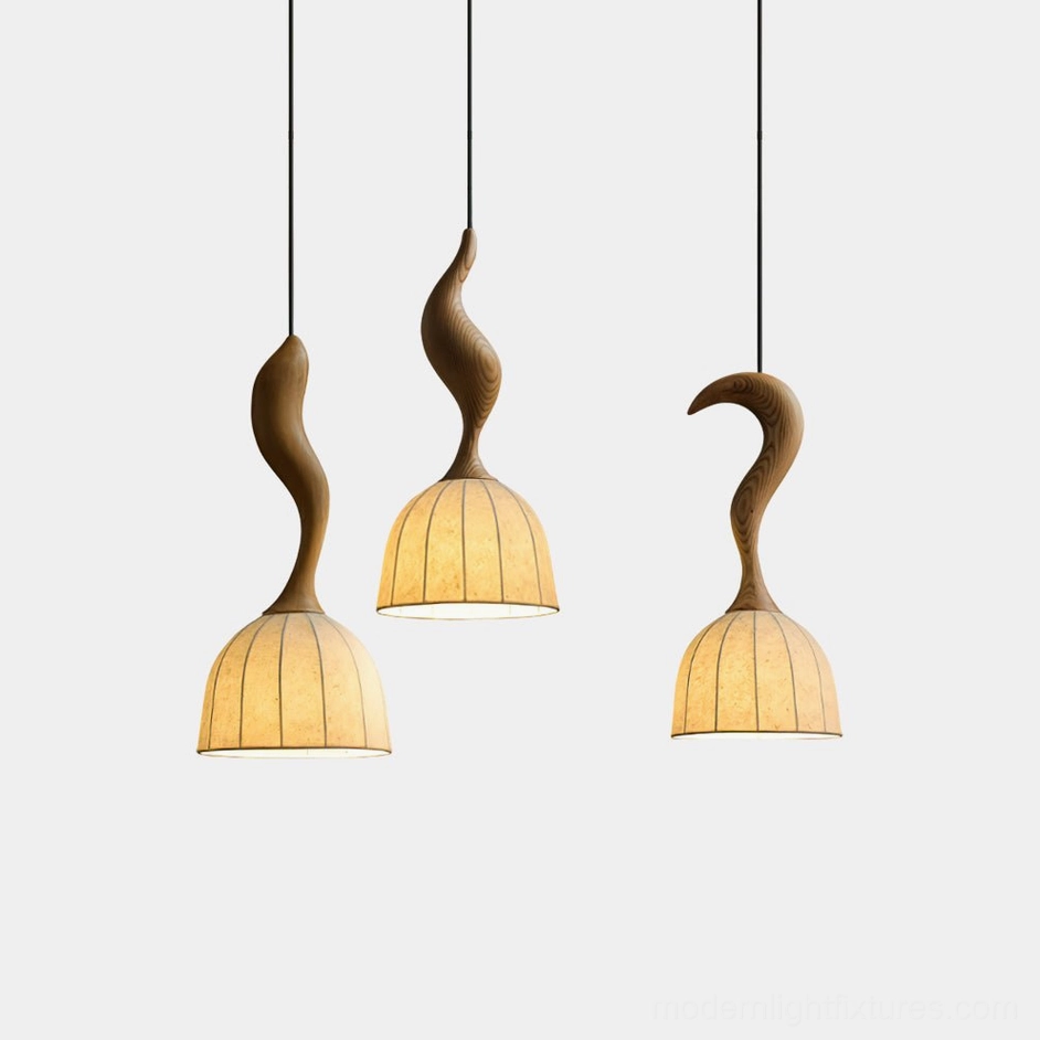 Solia modern wooden pendant light with curved wood stem and hand-pleated fabric shade, front view studio display