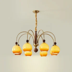 Mid-century modern Solstice Glow chandelier showing twisted brass rod detail and construction, light gray wall