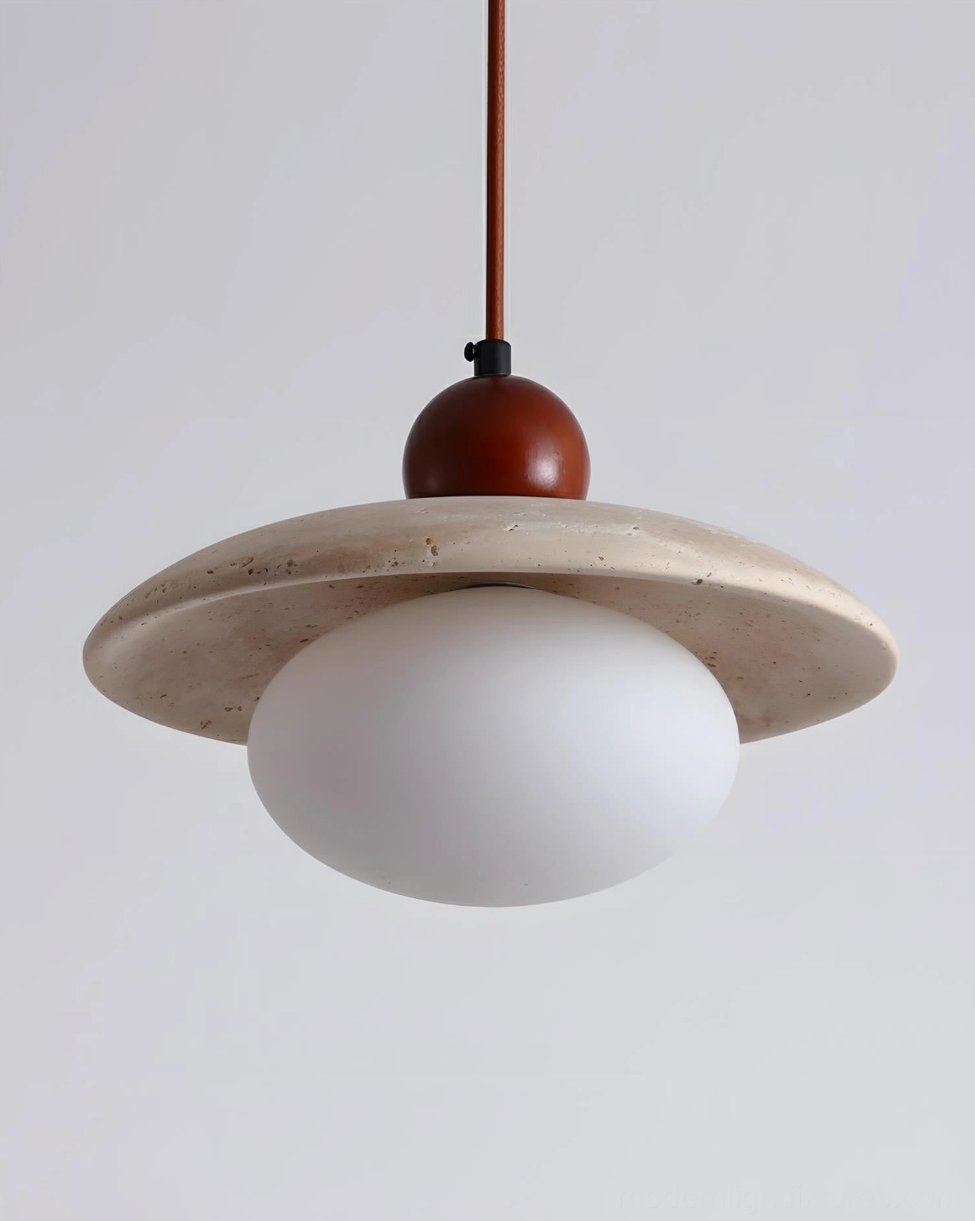 Solven travertine pendant fixture showing natural stone surface texture and pitting