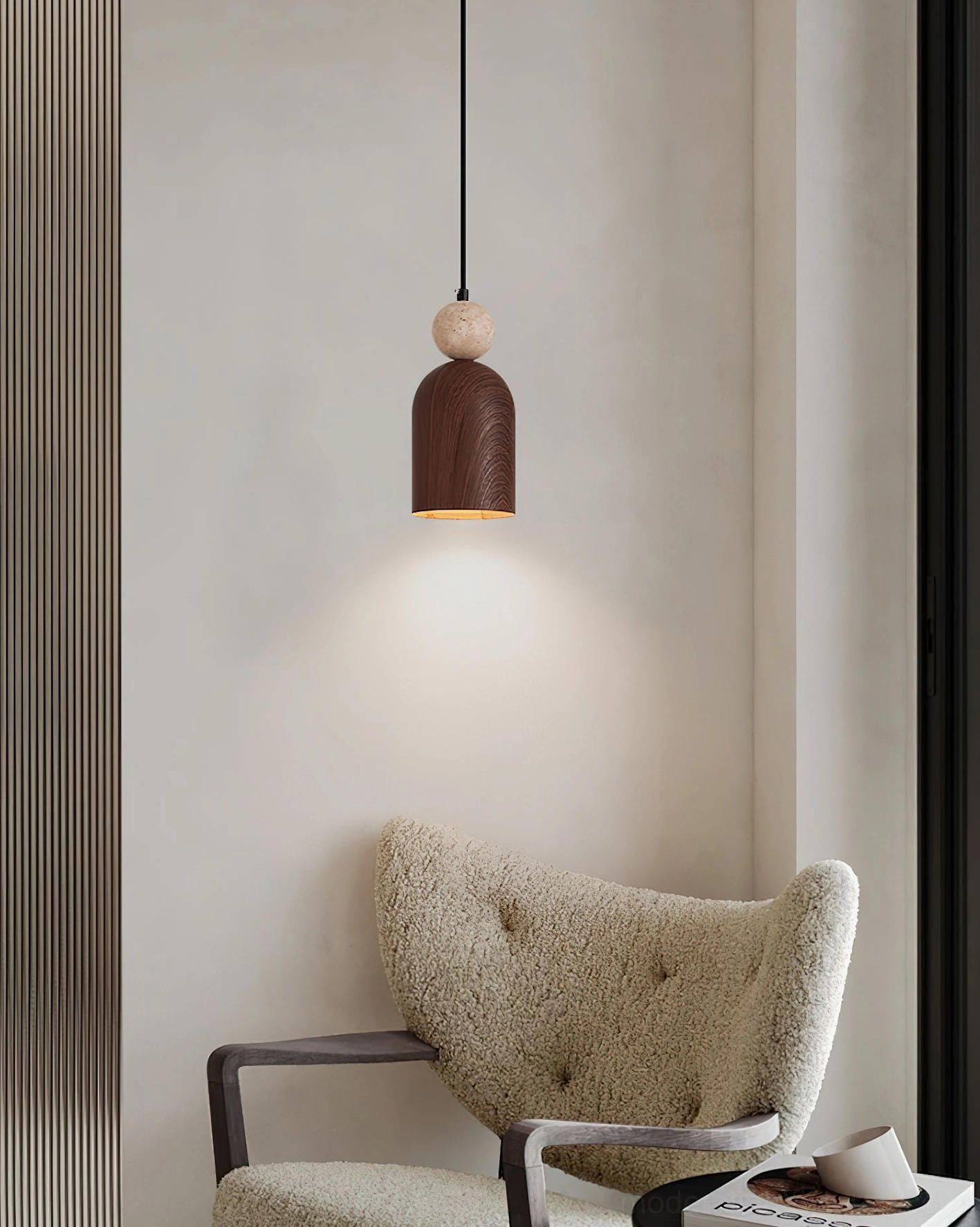 Somira modern pendant fixture close-up showing travertine stone sphere and metal shade craftsmanship detail
