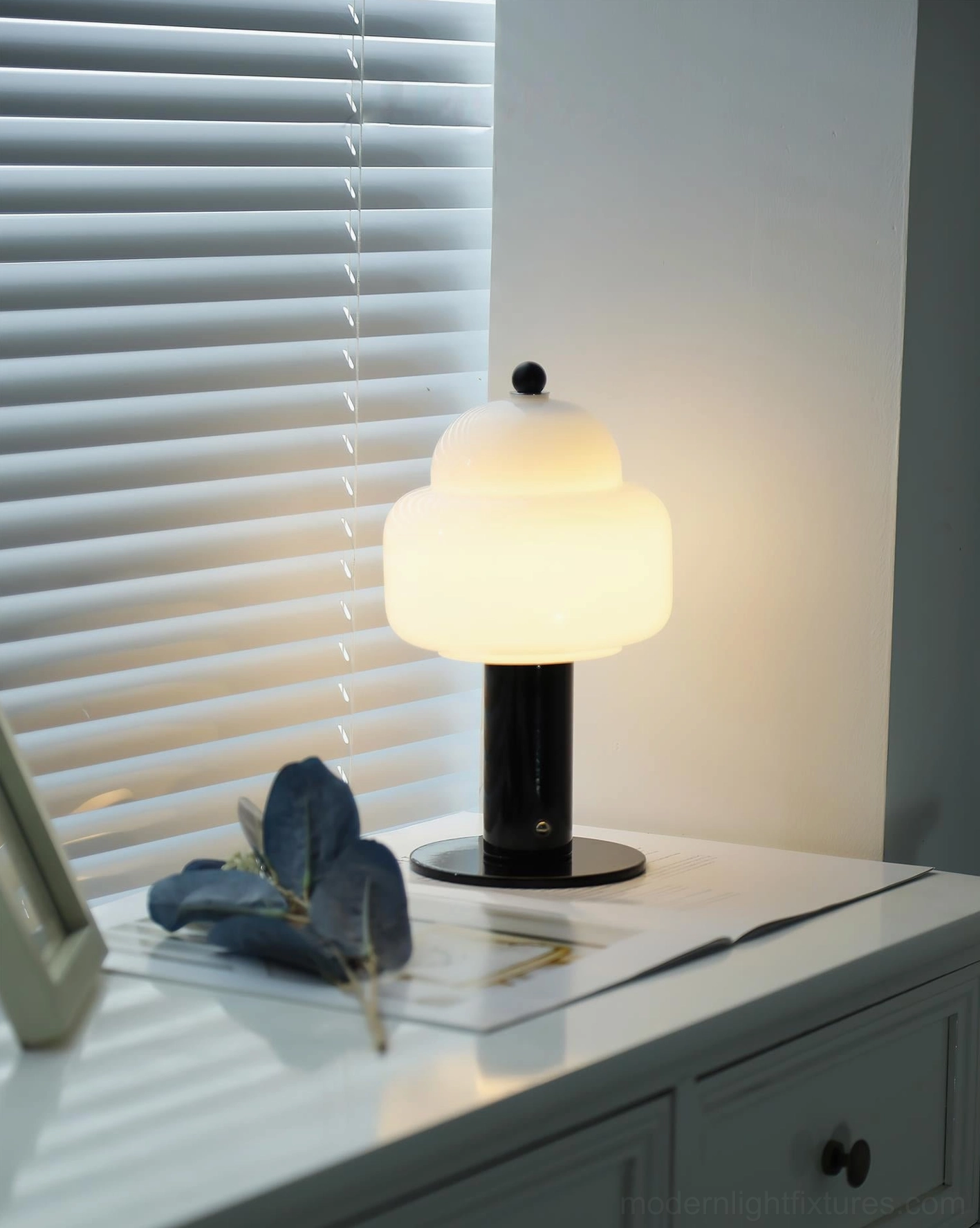 Soreli black table lamp on bedroom nightstand with frosted glass shade and warm LED light