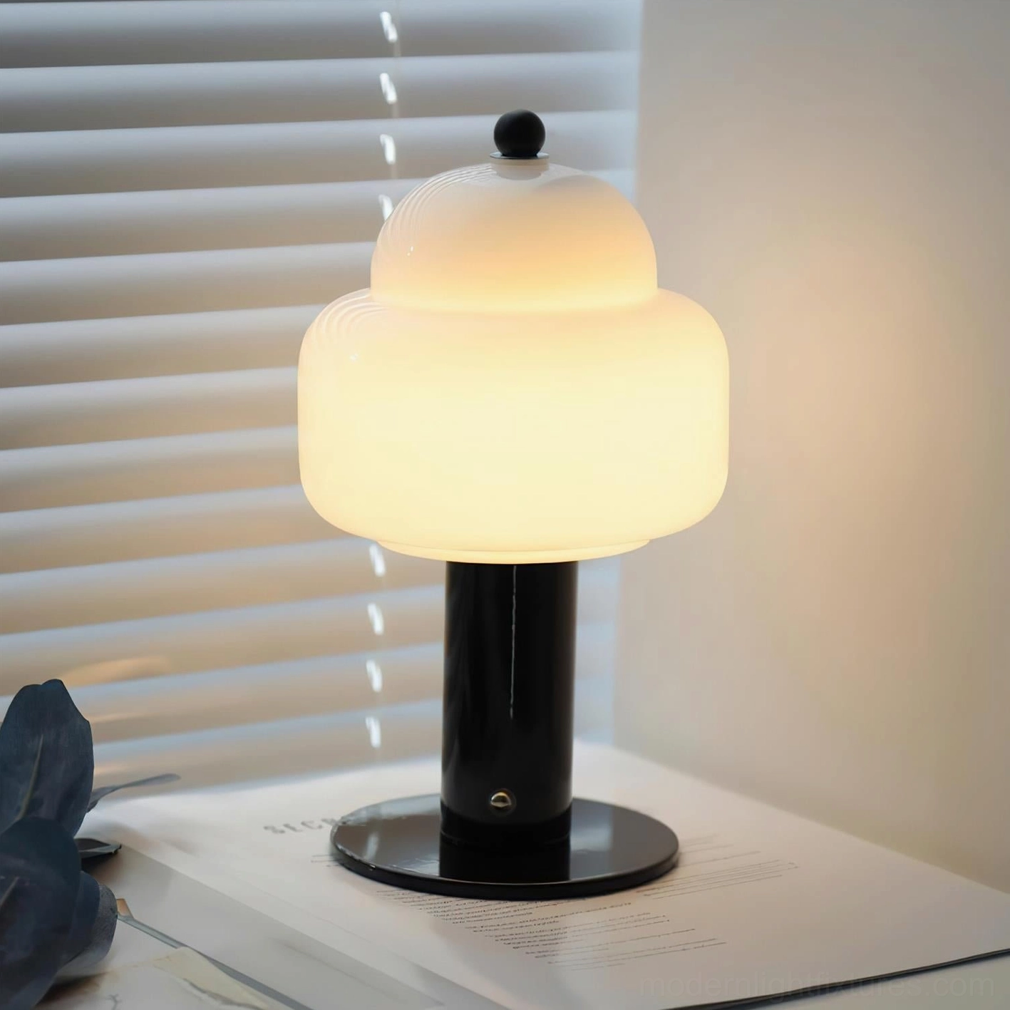Soreli black table lamp with cloud-like frosted glass shade and spherical finial on home desk