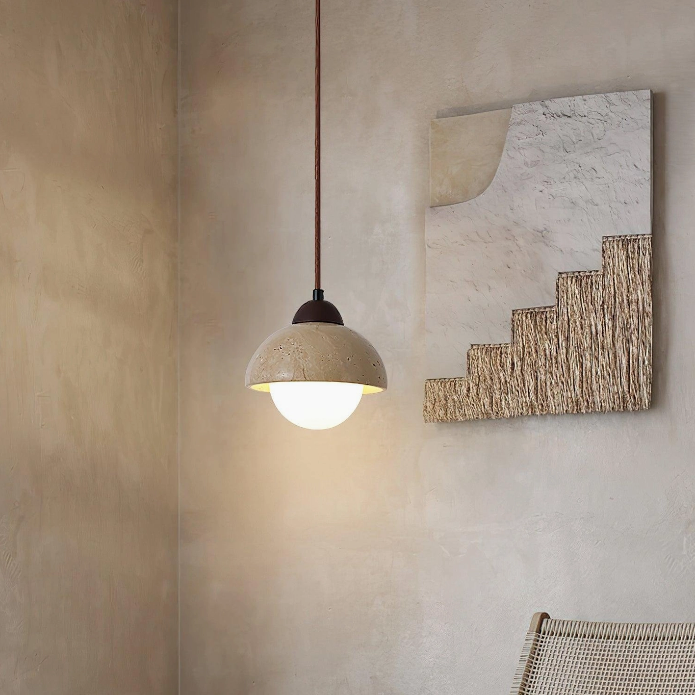 Soren travertine pendant light in living space with textured wall art minimalist neutral decor