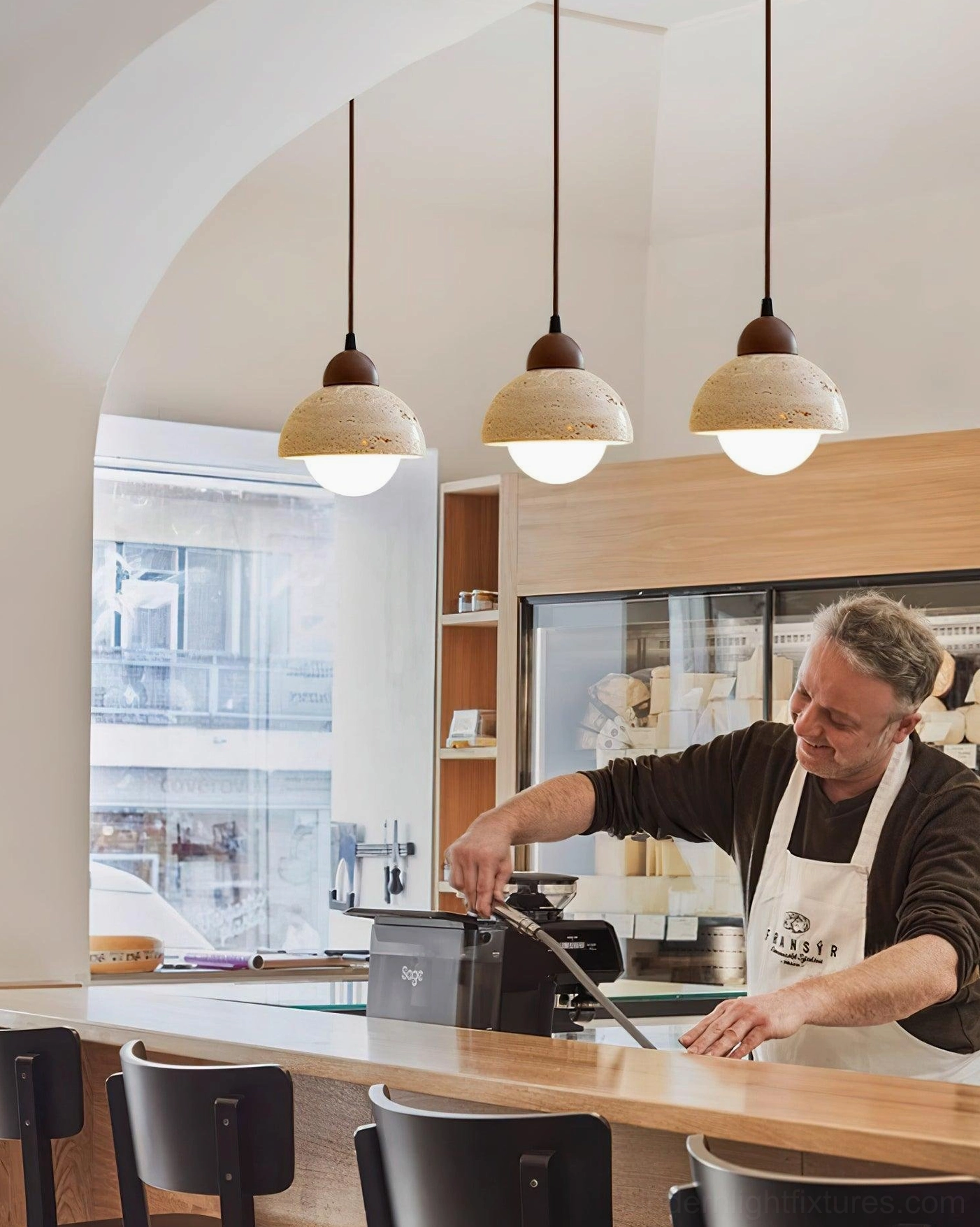 Soren travertine dome pendant light installed in scandinavian minimalist interior design