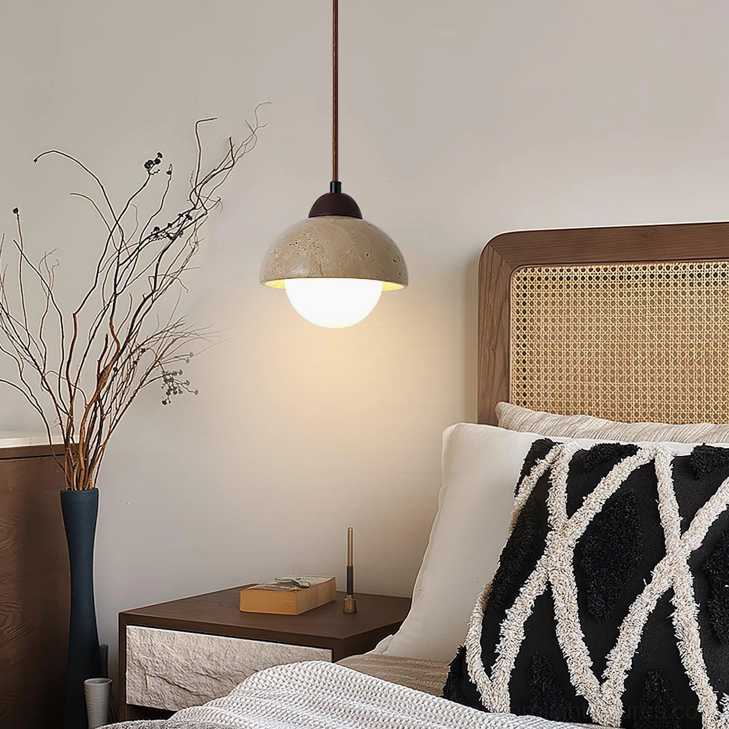 Soren travertine pendant light in cozy bedroom with rattan headboard boho rustic style