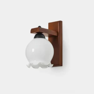 Sorra ruffled glass wall sconce with wooden mount and milky glass globe, modern wall lamp close-up studio view