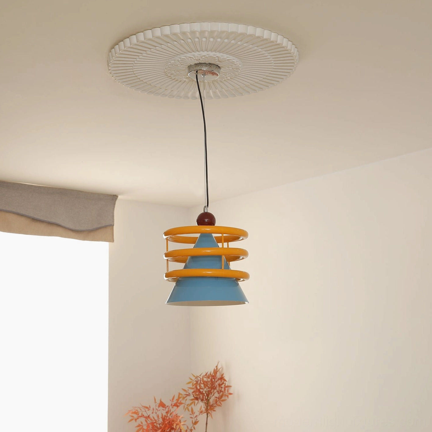 Sowden pendant light installed in residential room with window and dried plant decor, illuminated geometric shade