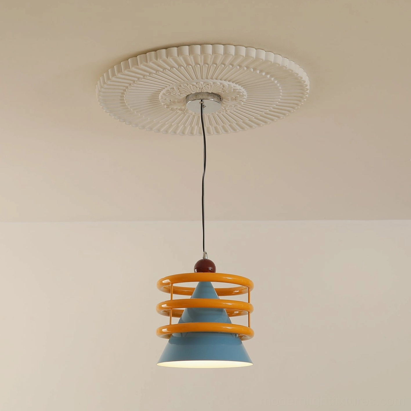 Sowden pendant light with yellow and blue color-blocking, right-side angle view in residential space