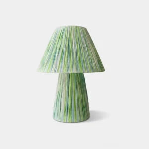 Space-dyed raffia mushroom table lamp with green striped pattern, frontal studio product view on white background