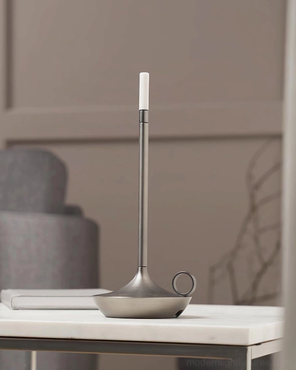 Minimalist LED table lamp demonstrating space-efficient compact design on narrow console table