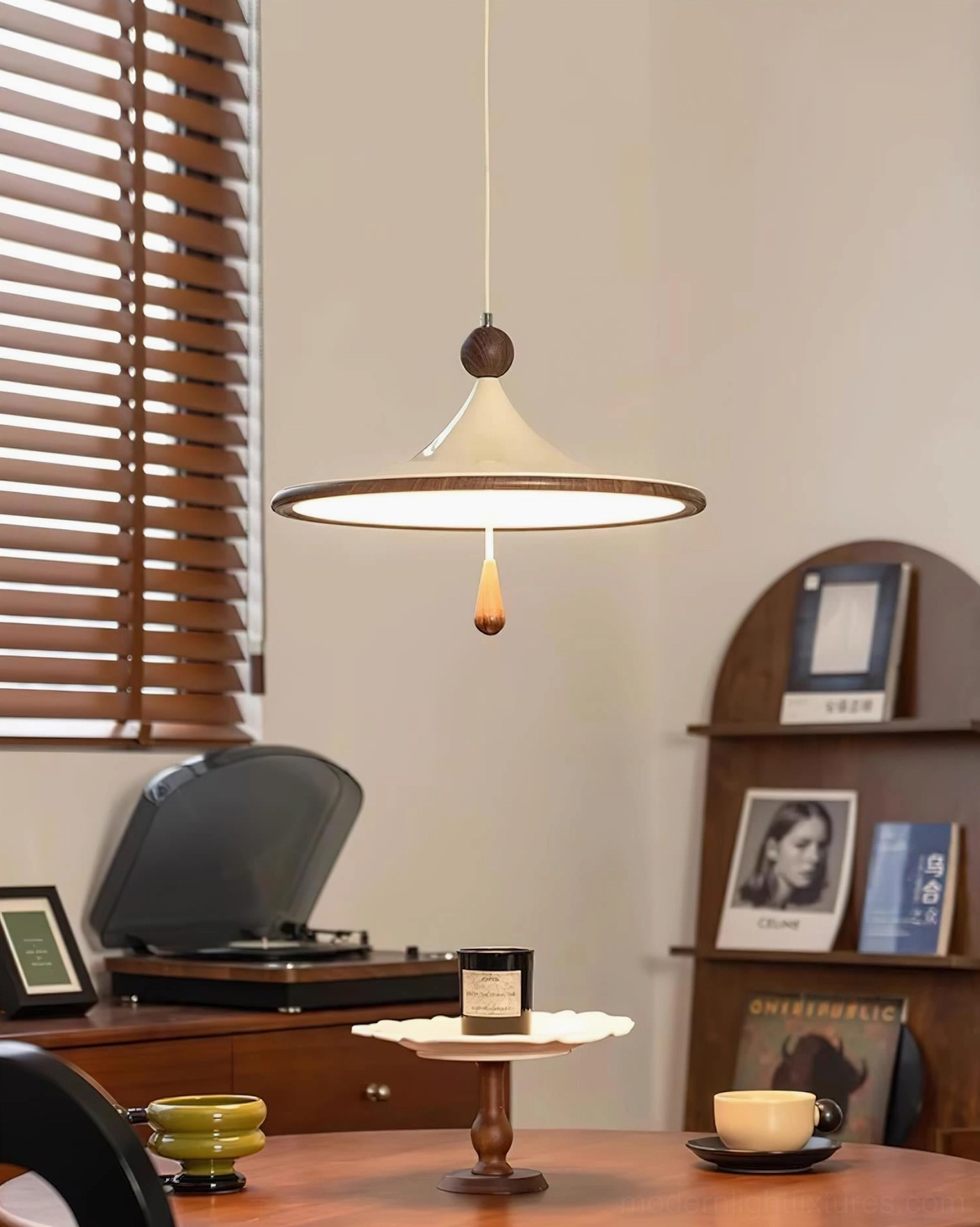Eye-level view of Spinora pendant lamp in mid-century modern dining room with wooden home decor and warm lighting