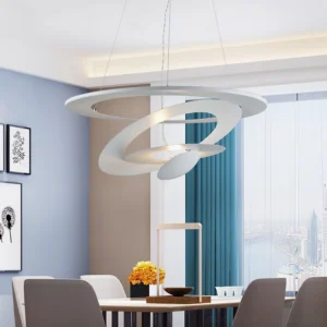 Contemporary spiral pendant light in dining room with warm LED illumination, layered circular design against blue walls