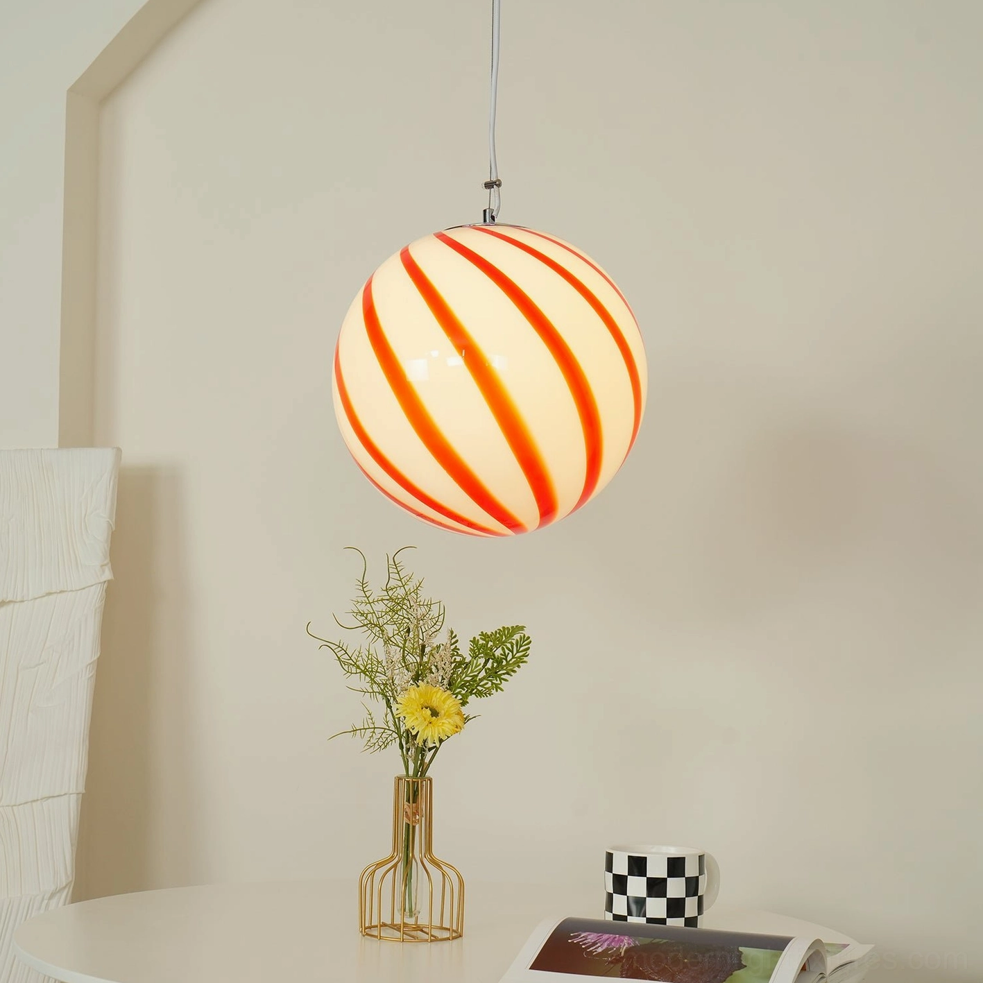 Spiral stripe pendant light hanging fixture showcasing the spherical glass globe shape and metal hardware assembly details
